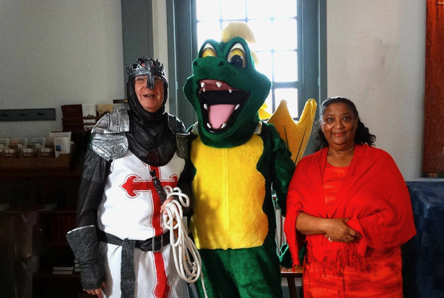 Posing together at the conclusion of the service honoring St. George are the chivalric St. George (Dan Reed), the symbolically evil dragon (Jim Brand), and the rescued maiden (Brenda Burgh). SUBMITTED PHOTOS